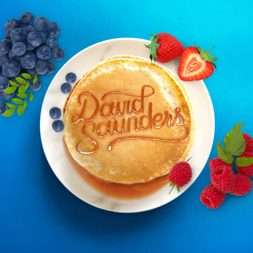 Pancakes with Syrup written in someone's name to showcase custom graphic design services